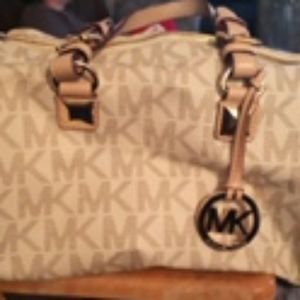 MK tan and white purse